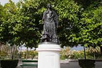 Spain, Andalucia, Seville, Statue of Carmen on Paseo de Cristobal Colon that runs adjacent to the Guadalquivir River.