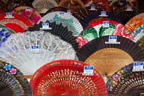 Spain, Andalucia, Seville, Hand painted Spanish fans abanicos on display in the window of Diaz, a boutique selling typical Spanish items.