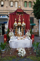 Spain, Andalucia, Seville, Temporary altar and shrine assembled in the street in the Triana district to celebrate the feast of Corpus Christi.