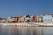Spain, Andalucia, Seville, Waterfront buildings of the Triana district beside the Rio Guadalquivir.