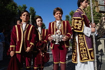 Spain, Andalucia, Seville, Altar boys including the incense boat carrier in the Corpus Chrisit procession from Iglesia de la Magdelena.