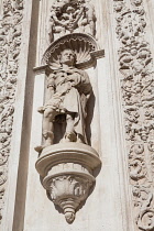 Spain, Andalucia, Seville, Sculpture on the facade of the Ayuntamiento Town Hall.