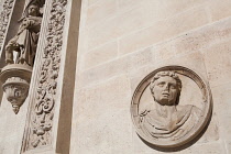 Spain, Andalucia, Seville, Sculpture and carving on the facade of the Ayuntamiento Town Hall.