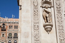 Spain, Andalucia, Seville, Sculpture on the facade of the Ayuntamiento Town Hall.