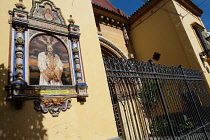 Spain, Andalucia, Seville, Tiled image of Jesus outside a local church in the Feria district.
