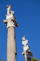 Spain, Andalucia, Seville, Roman columns with statues of Hercules and Julius Caesar at the southern entrance to Alameda de Hercules in Seville.