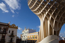 Spain, Andalucia, Seville, Las Setas with buildings of the Feria district in the background.