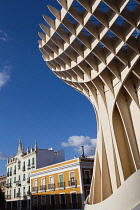 Spain, Andalucia, Seville, Las Setas with buildings of the Feria district in the background.