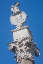 Spain, Andalucia, Seville, Statue of Caesar on the Roman column at the entrance to Alameda de Hercules.