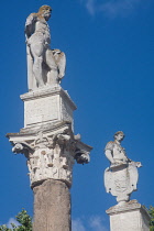 Spain, Andalucia, Seville, Statues of Hercules and Caesar on the Roman columns at the entrance to Alameda de Hercules.