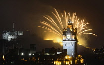 Scotland, Edinburgh, Fireworks for the closing of the Festival & Military Tattoo, view from Calton Hill across to the Castle with the clocktower & Balmoral Hotel.