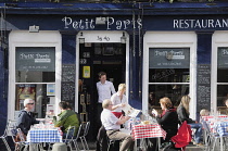 Scotland, Edinburgh, Grassmarket, Petit Paris restaurant with diners eating outside..