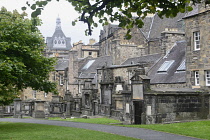 Scotland, Edinburgh, Greyfriars Highland Kirk cemetery, graves, mausoleums with Old Town houses behind..