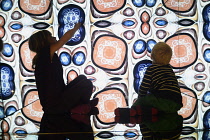 Scotland, Edinburgh, Camera Obscura, giant kaleidescope with 2 children .