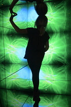 Scotland, Edinburgh, Camera Obscura, giant kaleidescope with child standing in it.