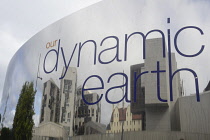 Scotland, Edinburgh, Our Dynamic Earth, mirror sign with Scottish Parliament building reflected in it.