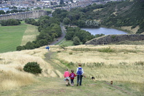 Scotland, Edinburgh, Holyrood Park, views towards city centre from Holyrood Park with walkers.