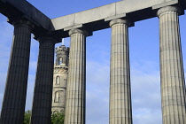 Scotland, Edinburgh, Calton Hill, National Monument with Nelson monument in distance.