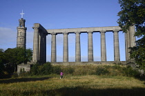 Scotland, Edinburgh, Calton Hill, National Monument with Nelson monument in distance.