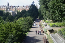 Scotland, Edinburgh, Princes Street gardens, West Princes Street gardens with people walking in the sun.