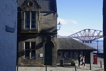 Scotland, Edinburgh, South Queensferry, street corner with Forth Rail Bridge in distance.