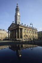 Scotland, Glasgow, East End, St Andrew's parish church & reflection in parked car.