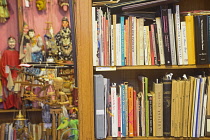 Scotland, Glasgow, City centre west, Mitchell Library, The World Through Wooden Eyes puppet store, puppeteer John Blundall's collection Puppets and reference books.