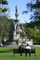 Scotland, Glasgow, West End, Kelvingrove Park, Stewart Memorial Fountain and park bench.