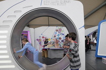 Scotland, Glasgow, West End, Glasgow Science Centre, play on the hamster wheel.