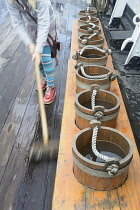 Scotland, Glasgow, West End, The Tall Ship, sloshing the deck.