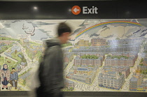 Scotland, Glasgow, West End Hillhead Subway, Alasdair Gray mural at newly refurbished Hillhead subway with figure walking past.