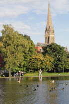 Scotland, Glasgow, South Side, Queen's Park, duck pond and spire of Queen's Park Church of Scotland.