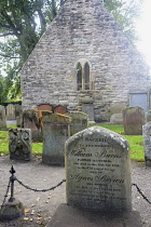 Scotland, Burns Country, Burns National Heritage Park, Auld Alloway Kirk and graveyard with headstone of William Burns.