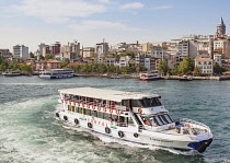 Turkey, Istanbul, Passenger ferry in the Golden Horn, and Galata Tower.