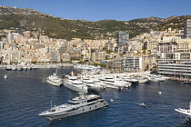 France, Monaco, Yachts moored in Monaco Harbour, Port Hercule, and La Condamine.