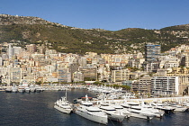 France, Monaco, Yachts moored in Monaco Harbour, Port Hercule, and La Condamine.