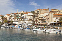 France, Corsica, Calvi, Calvi Harbour and waterfront buildings.