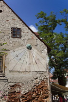 Croatia, Zagreb, Old Town, Tkalciceva Streetsundail on restaurant wall..
