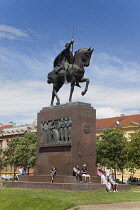Croatia, Zagreb, Old town, Park Josipa Jurja Strossmayera, People sat at base of Kralj Tomislav statue.