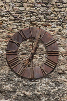 Croatia, Zagreb, Old town, Metal clock on wall outside Catholic cathedral.