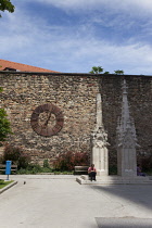 Croatia, Zagreb, Old town, Metal clock on wall outside Catholic cathedral.