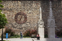 Croatia, Zagreb, Old town, Metal clock on wall outside Catholic cathedral.