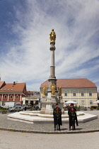 Croatia, Zagreb, Old town, Ceremonial guards and Statue of the Blessed Virgin Mary outside Catholic cathedral.