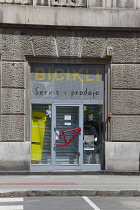 Croatia, Zagreb, Old town, Bicycle store with bike frame door handle.