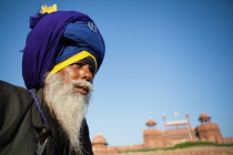 India, Delhi, Portrait of a male Sikh in front of the Red Fort in Delhi.