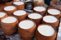 India, Delhi, Pots of lassi for sale in the old city of Delhi.