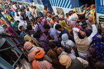 India, Haryana, Rohtak, Passengers board a train at Rohtak railway station.