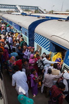 India, Haryana, Rohtak, Passengers board a train at Rohtak railway station.