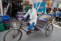 India, Haryana, Rohtak, Portrait of a rickshaw rider in Rohtak.