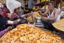 India, Rajasthan, Bikaner, Vendor selling namkeen, chat and savoury snacks in the market at Bikaner.